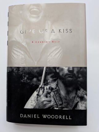 Item #19 Give Us A Kiss. Daniel Woodrell